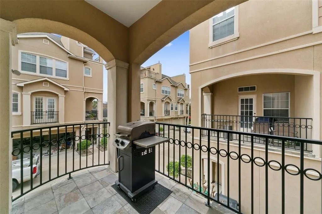 5615 Winsome Lane, Unit H Houston, TX 77057 - Photo 10 of 24 a view of a brick house with large windows