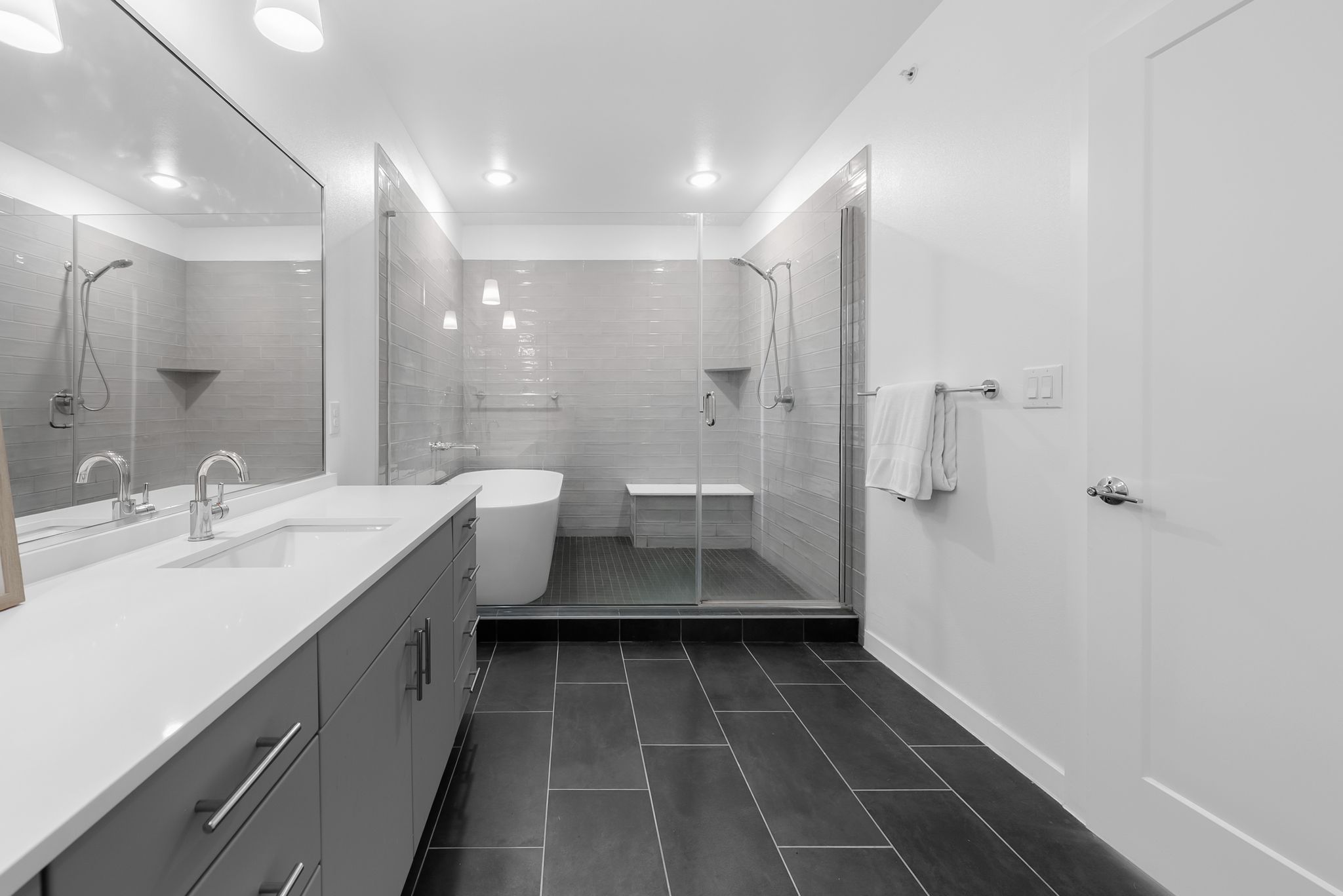 4801 Springdale Road, Unit 2410 Austin, TX 78723 - Photo 24 of 33 Primary bathroom enjoys a spa-like wet room with soaking tub and oversized shower.