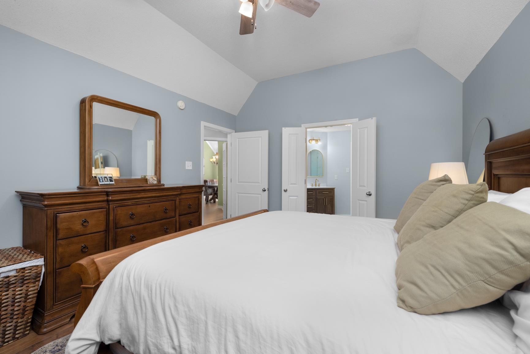 505 Terry Road Oakland, TN 38060 - Photo 23 of 40 Bedroom with lofted ceiling, a ceiling fan, connected bathroom, and wood finished floors