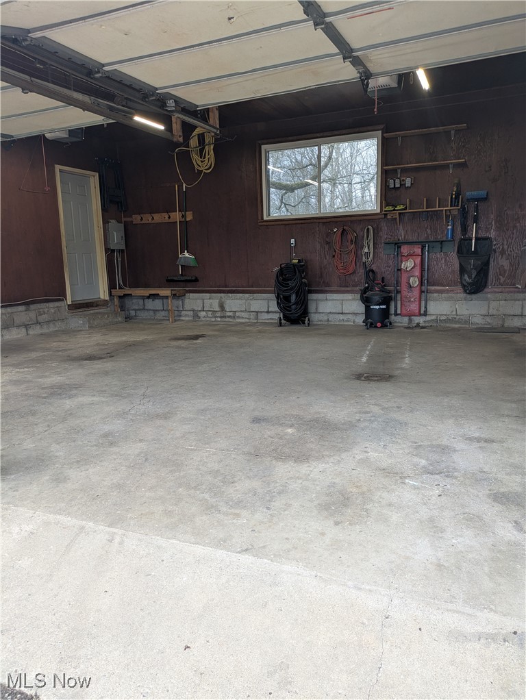 9581 Colton Road Windham, OH 44288 - Photo 6 of 26 Garage featuring a garage door opener