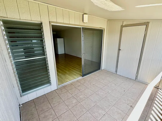 a view of a hardwood & utility room