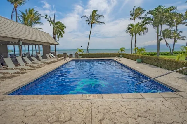 a view of swimming pool with sitting area