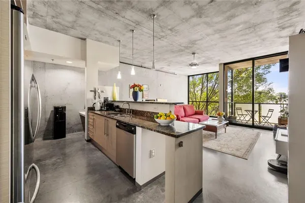 a kitchen that has a lot of cabinets in it