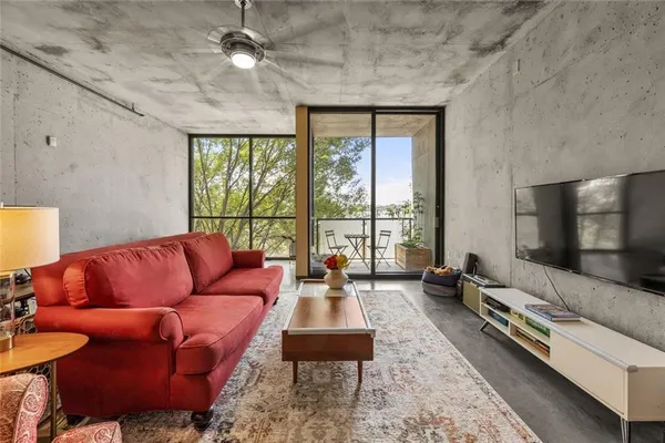 a living room with furniture and a flat screen tv