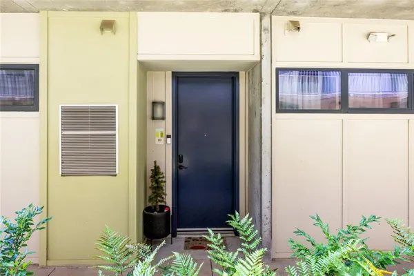 a view of a door and a window