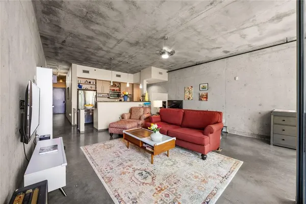a living room with furniture and a flat screen tv