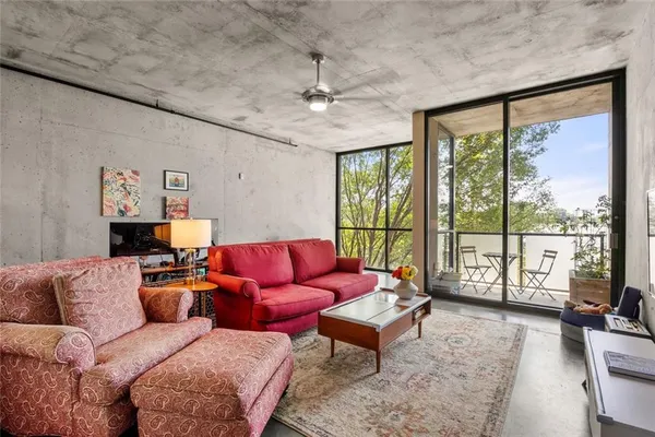 a living room with furniture and a large window