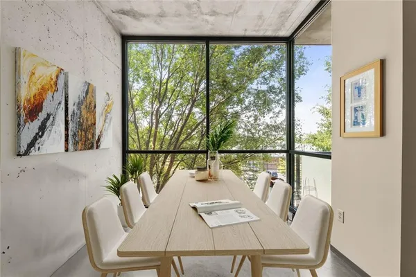 a view of a dining room with furniture window and outside view