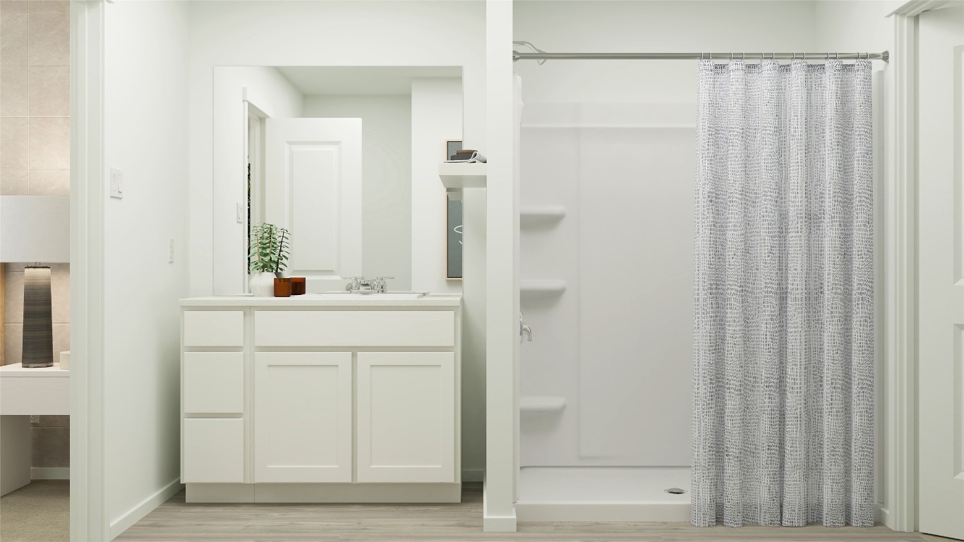 426 Silvercloud Drive Lockhart, TX 78644 - Photo 26 of 30 a bathroom with a sink and a mirror