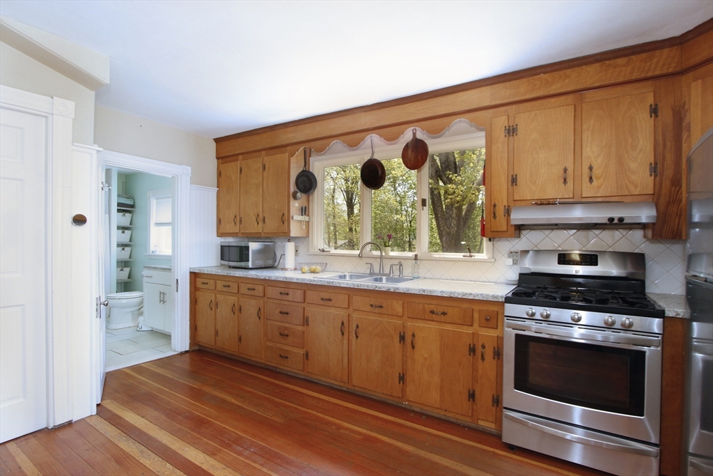 2 High Street Middleboro, MA 02346 - Photo 8 of 41 a kitchen with stainless steel appliances a stove a sink and a refrigerator