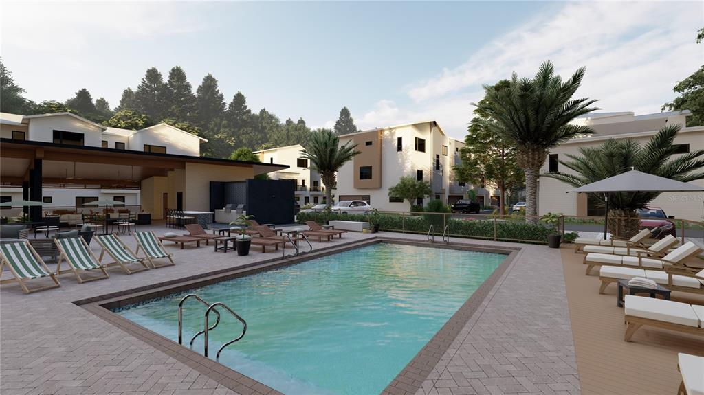 2611 Southwest Williston Road, Unit 4 Gainesville, FL 32608 - Photo 38 of 39 a view of a swimming pool with sitting area