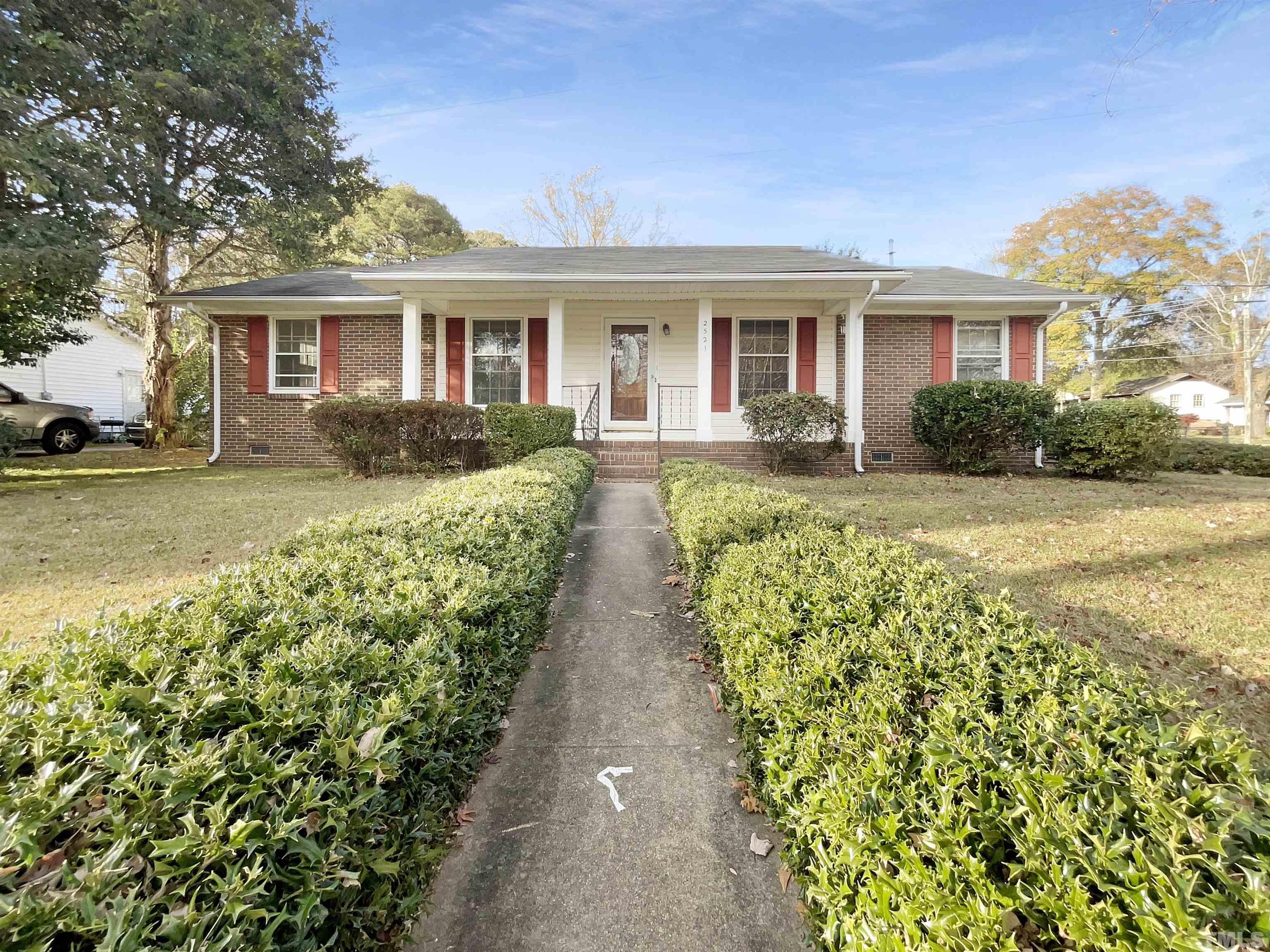 2521 Little John Road Raleigh, NC 27610 - Photo 1 of 18 front view of a house with a yard