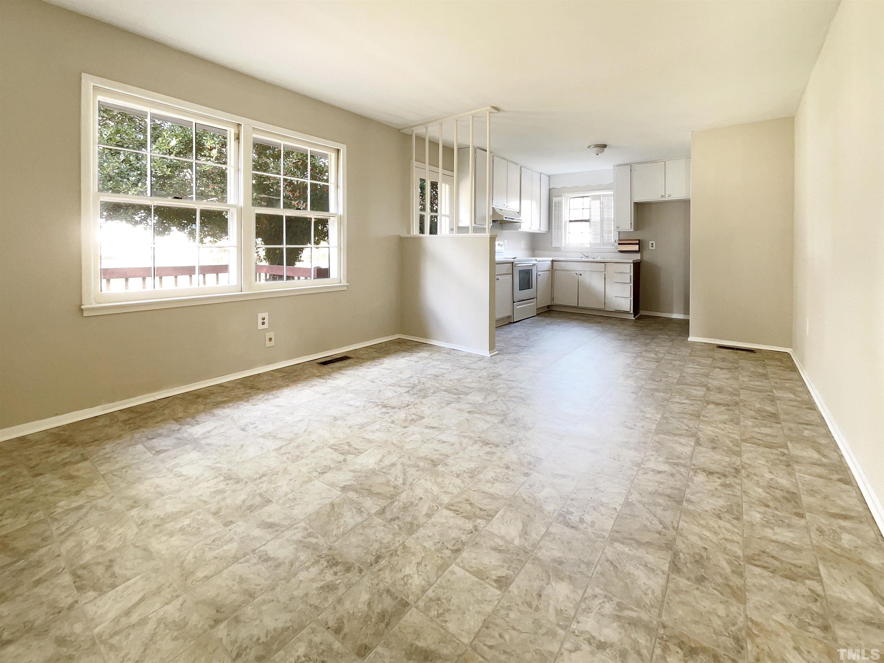 2521 Little John Road Raleigh, NC 27610 - Photo 11 of 18 a view of a kitchen with furniture and windows