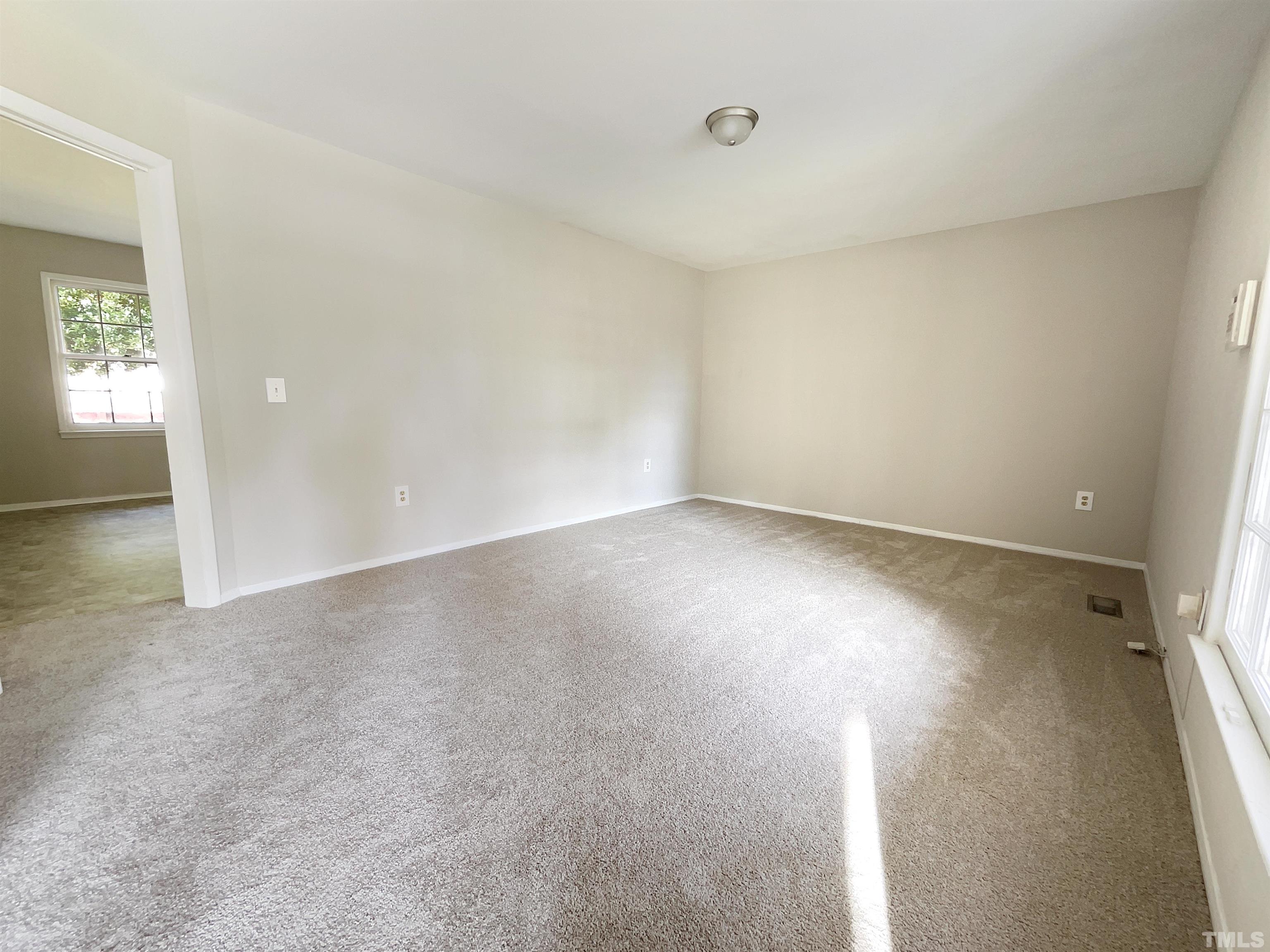 2521 Little John Road Raleigh, NC 27610 - Photo 3 of 18 an empty room with windows