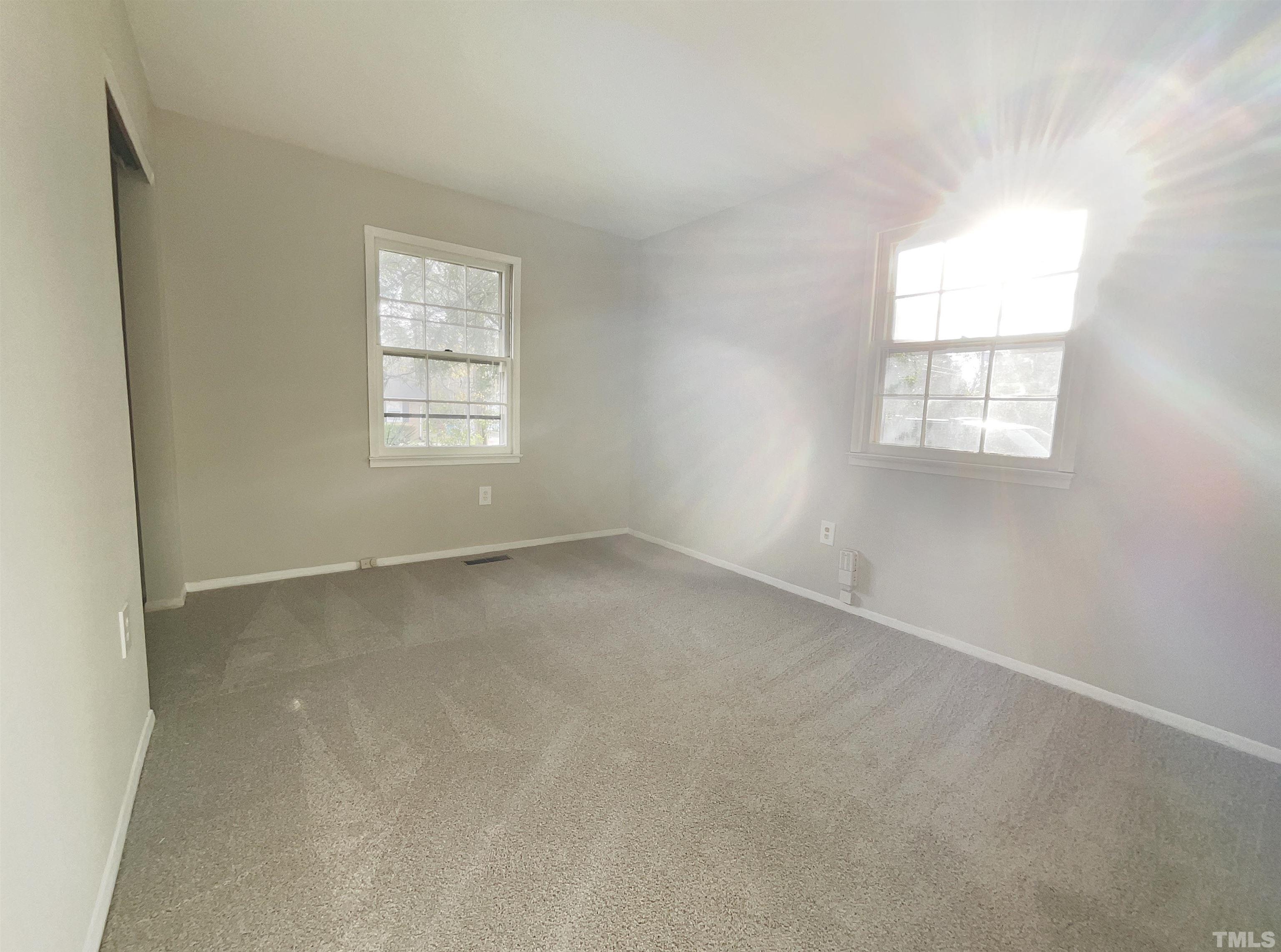 2521 Little John Road Raleigh, NC 27610 - Photo 5 of 18 an empty room with a window