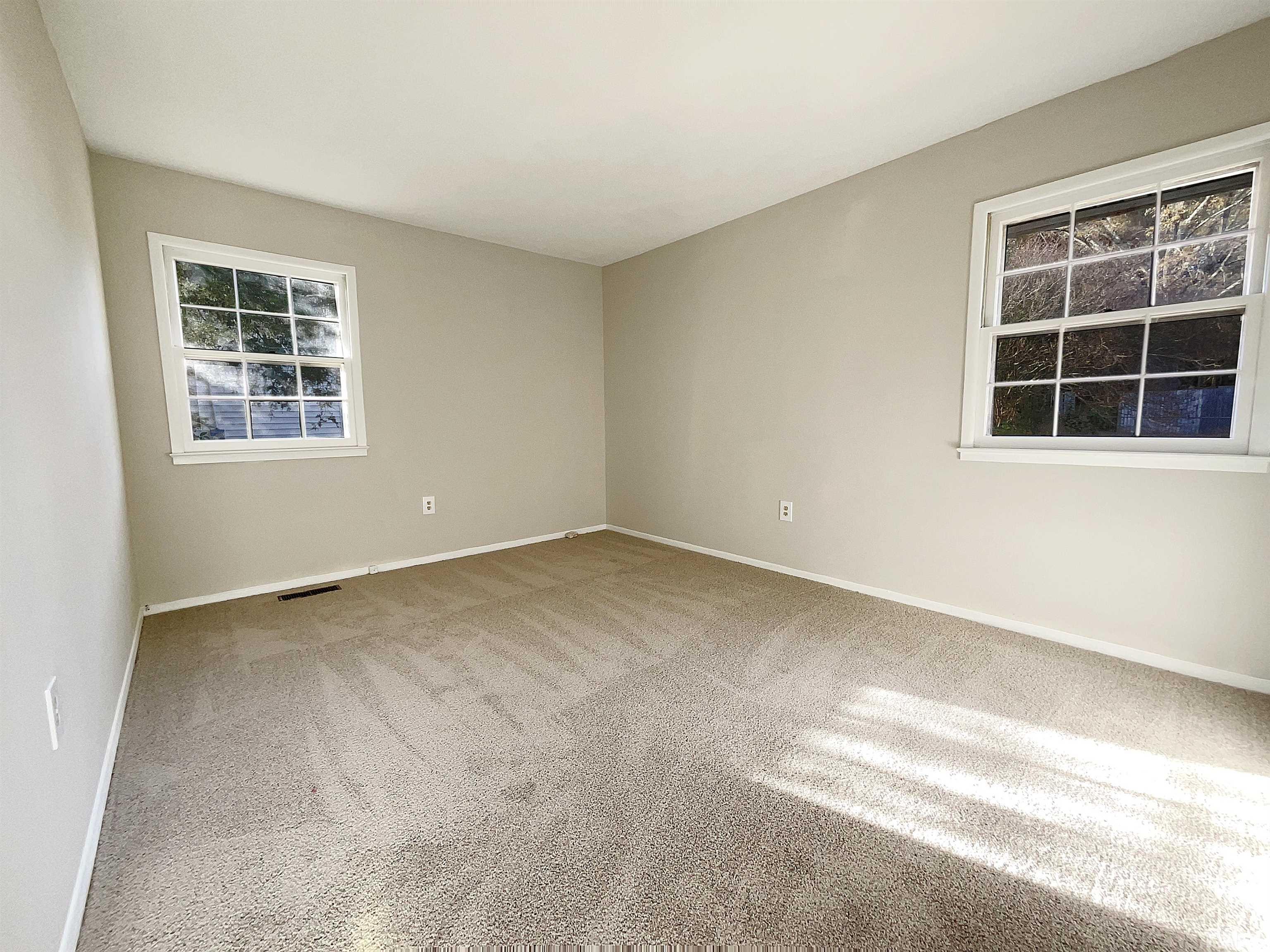 2521 Little John Road Raleigh, NC 27610 - Photo 7 of 18 an empty room with a window