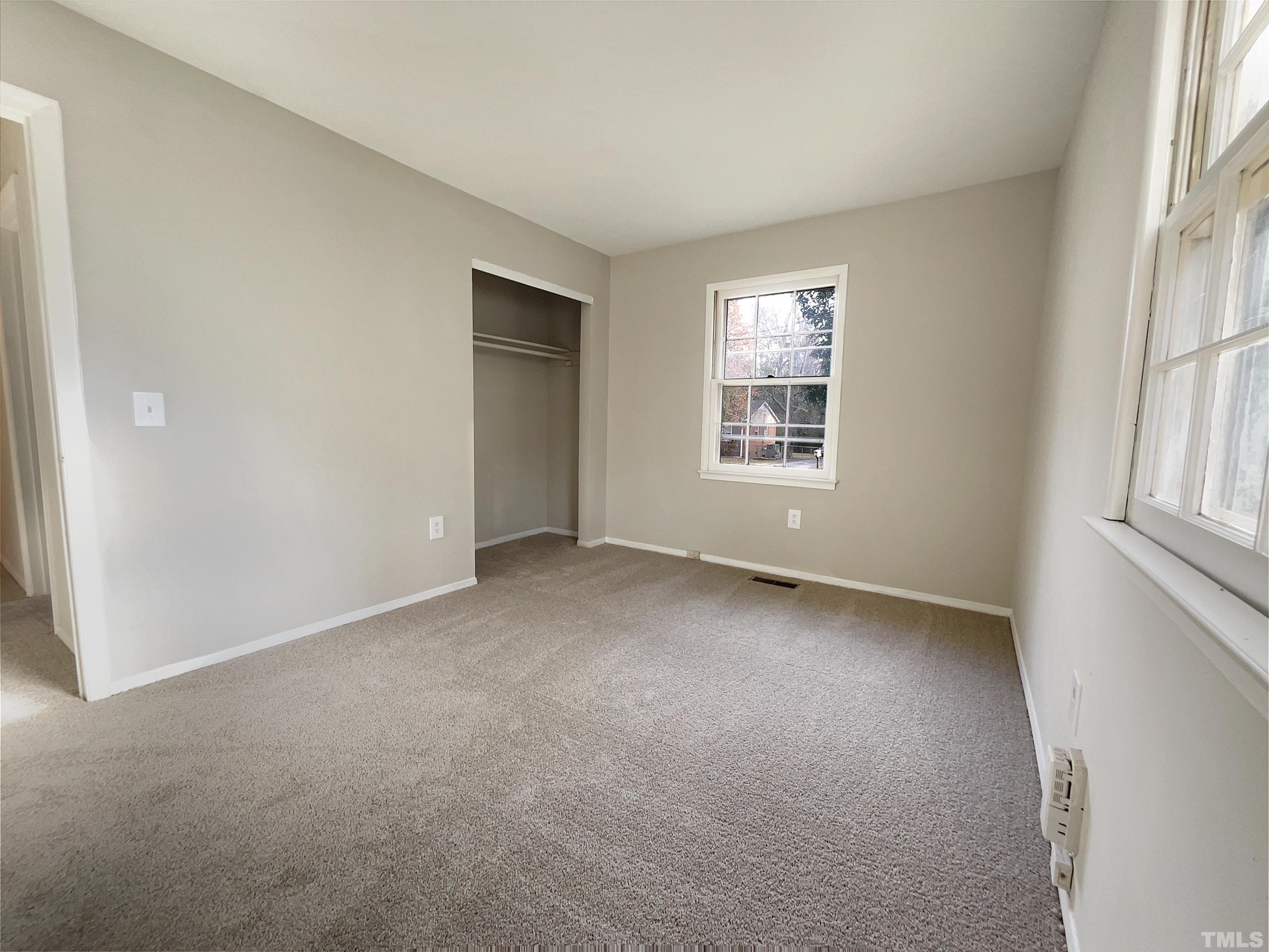 2521 Little John Road Raleigh, NC 27610 - Photo 8 of 18 an empty room with windows