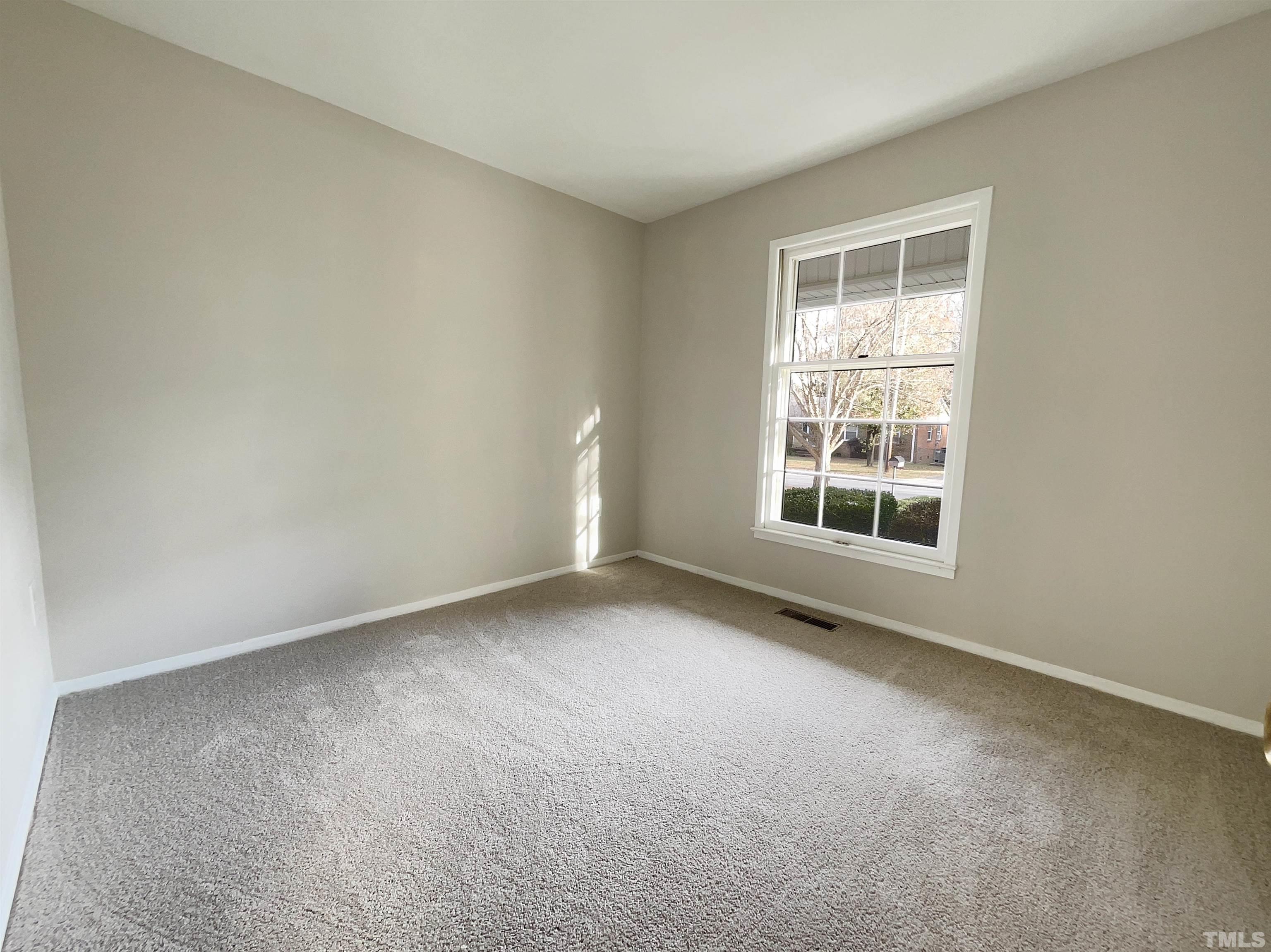 2521 Little John Road Raleigh, NC 27610 - Photo 9 of 18 an empty room with a window
