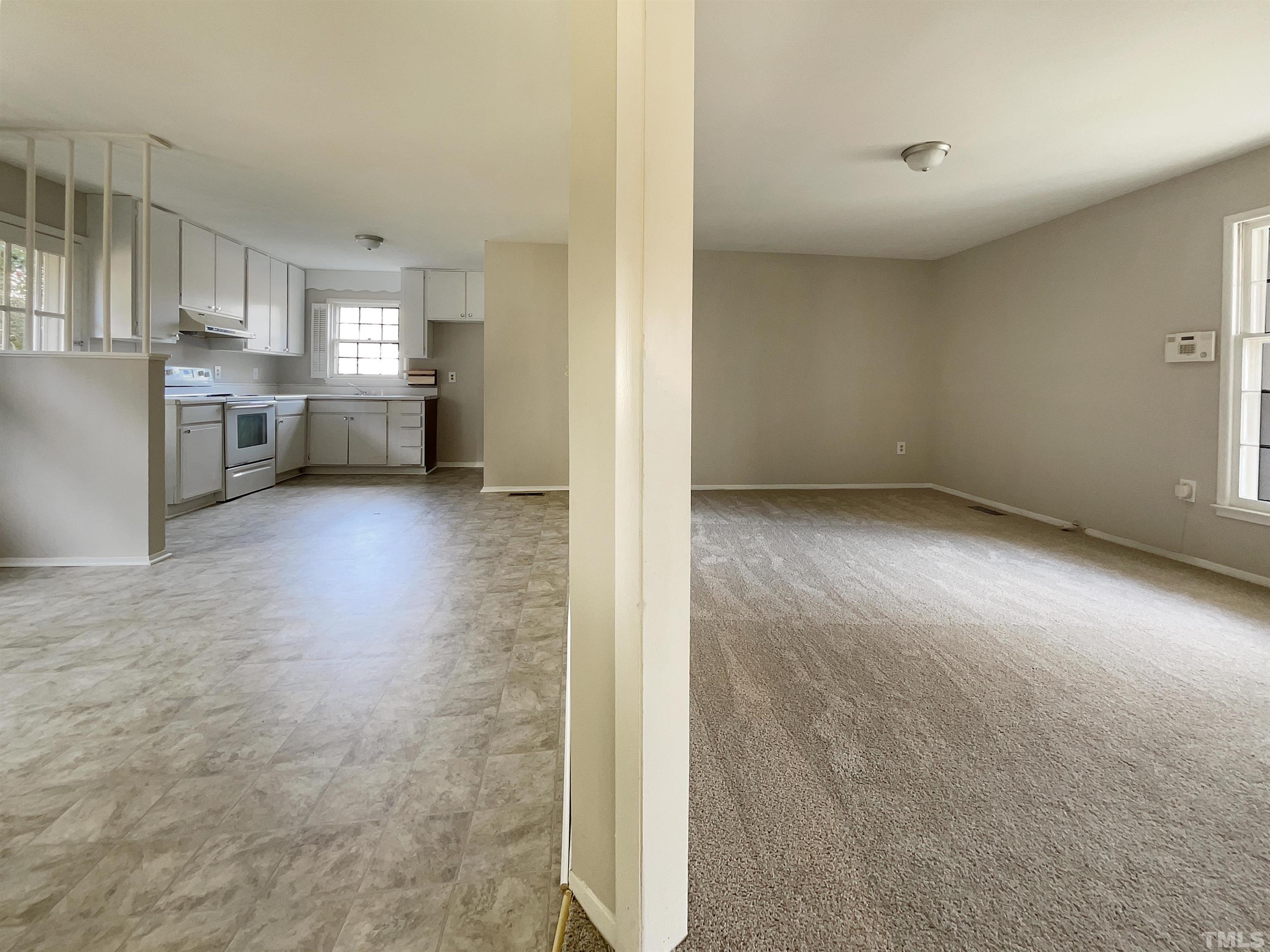 2521 Little John Road Raleigh, NC 27610 - Photo 10 of 18 a view of a kitchen with refrigerator and a sink