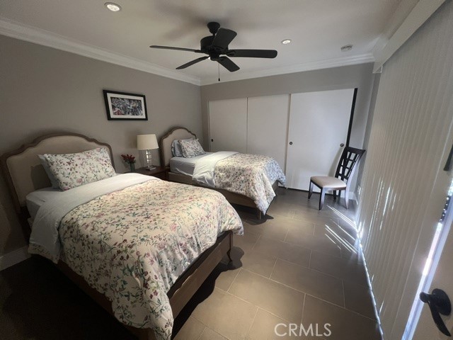 36 El Toro Drive Rancho Mirage, CA 92270 - Photo 13 of 25 a bed room with two beds and a ceiling fan