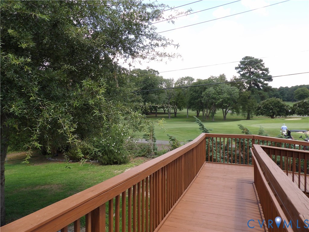 3813 Johnson Road Petersburg, VA 23805 - Photo 14 of 51 Expansive wooden deck with railing overlooking a m