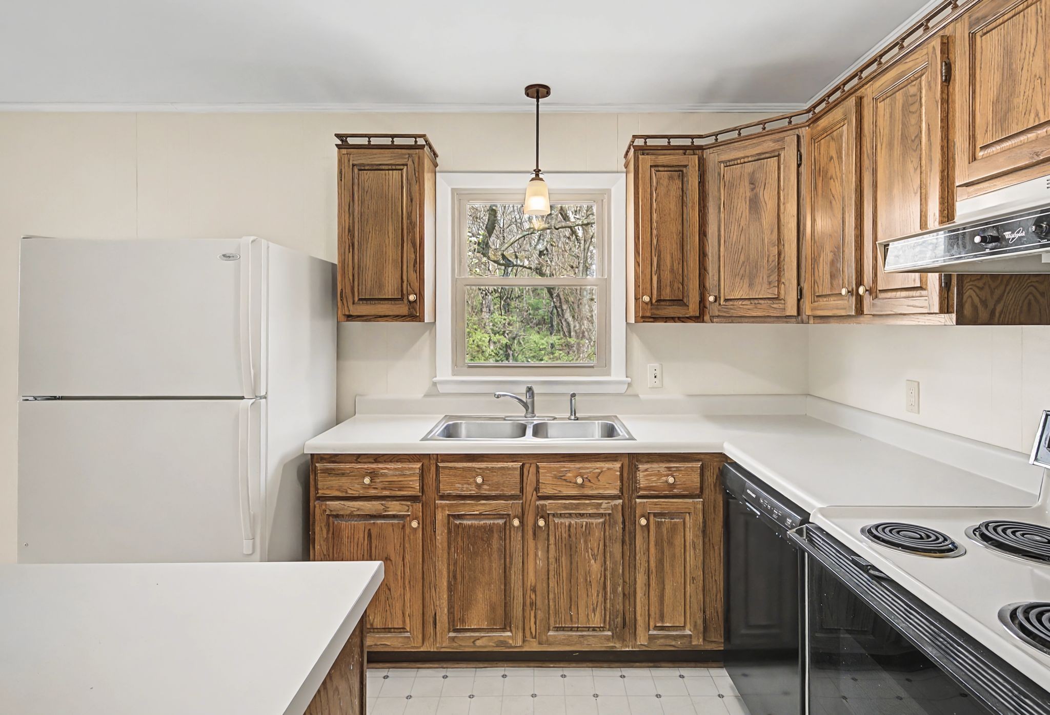520 Holt Valley Road Nashville, TN 37209 - Photo 14 of 47 a kitchen with a stove a sink and a refrigerator