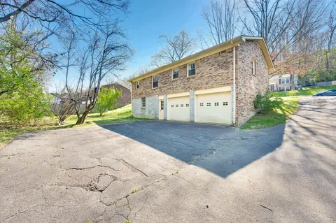 a view of a yard and a house