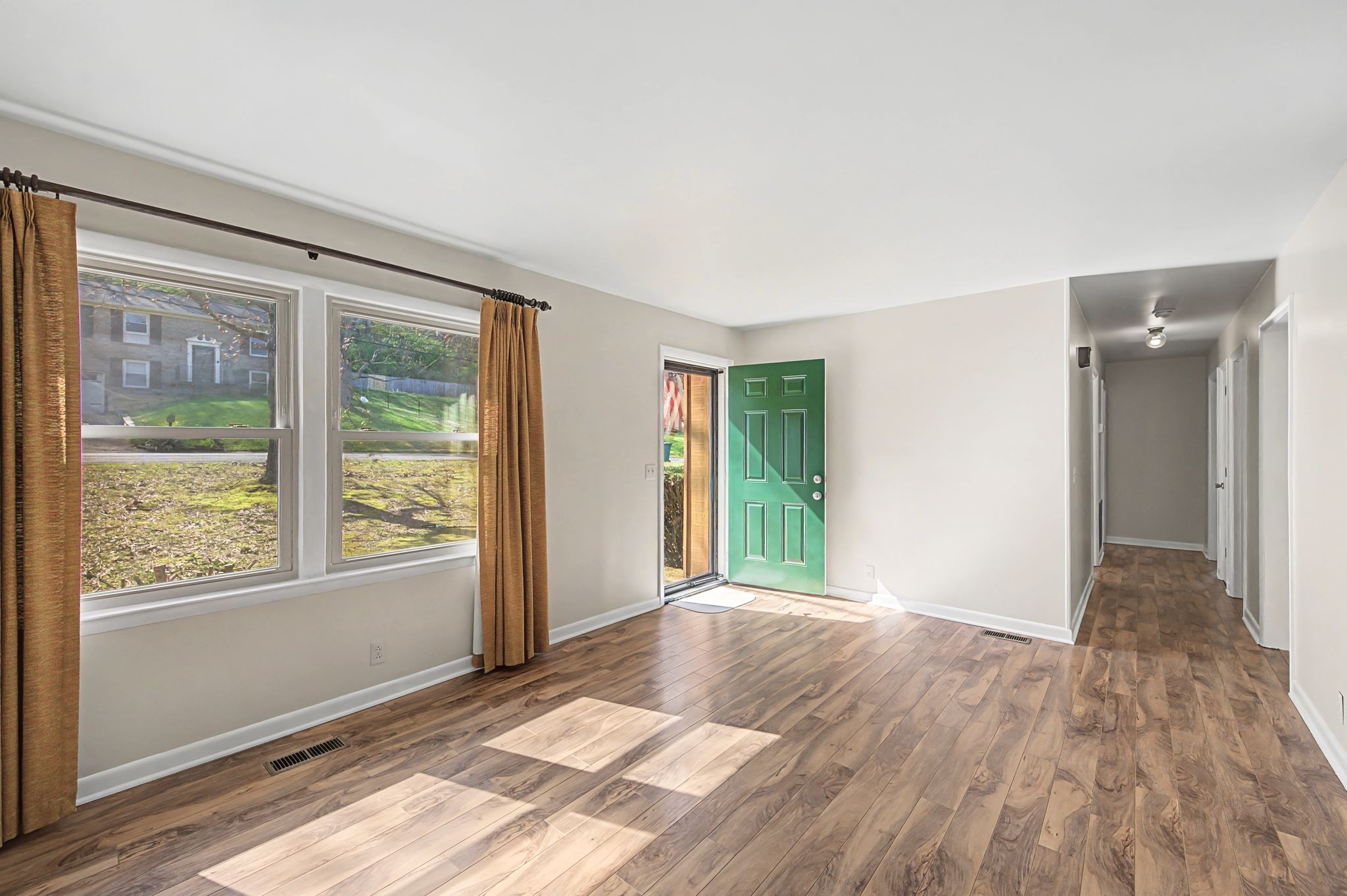 520 Holt Valley Road Nashville, TN 37209 - Photo 7 of 47 a view of an empty room with glass door and a window