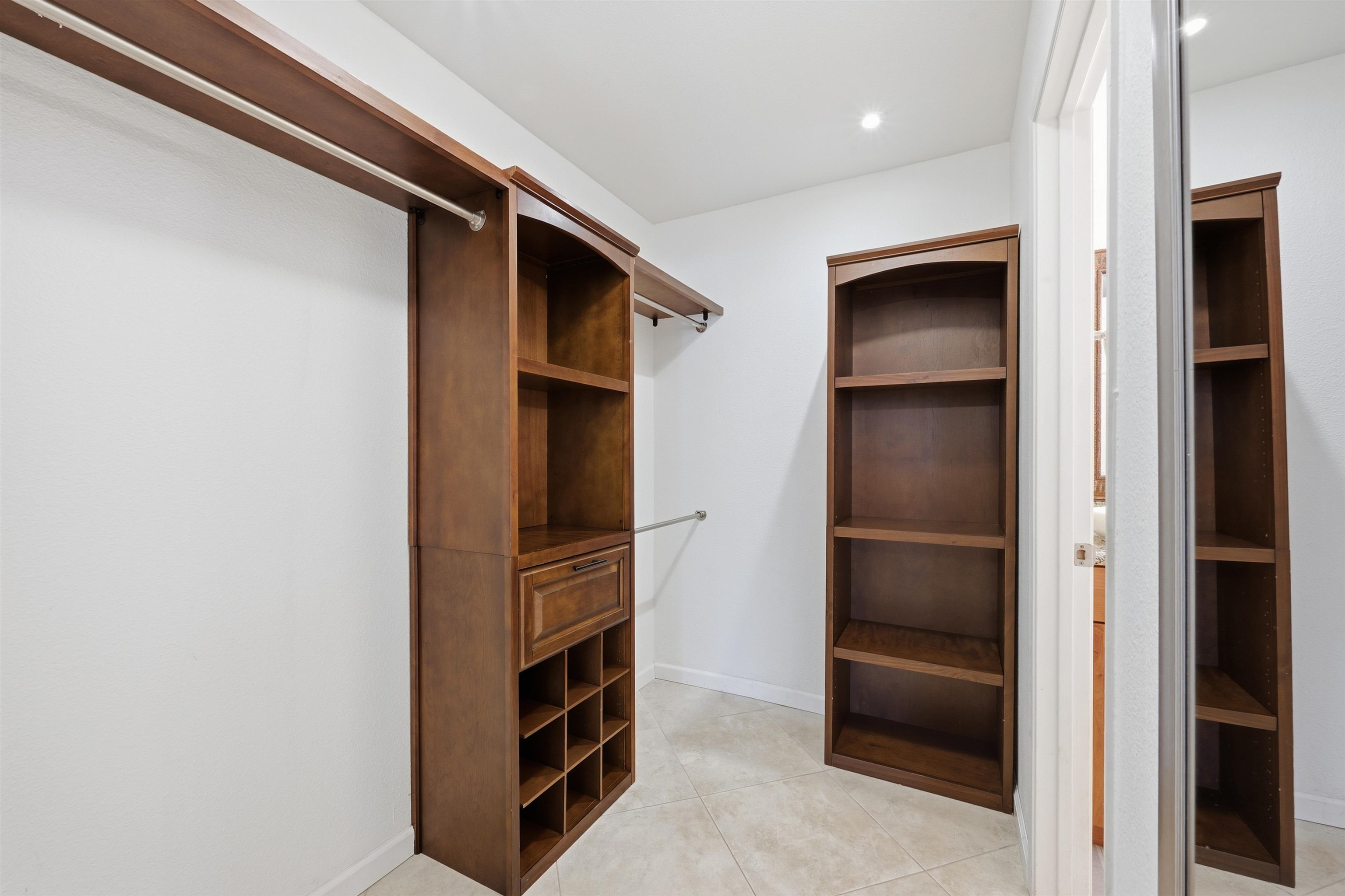 140 Uwapo Road, Unit 39101 Kihei, HI 96753 - Photo 15 of 35 a kitchen with stainless steel appliances a refrigerator and cabinets