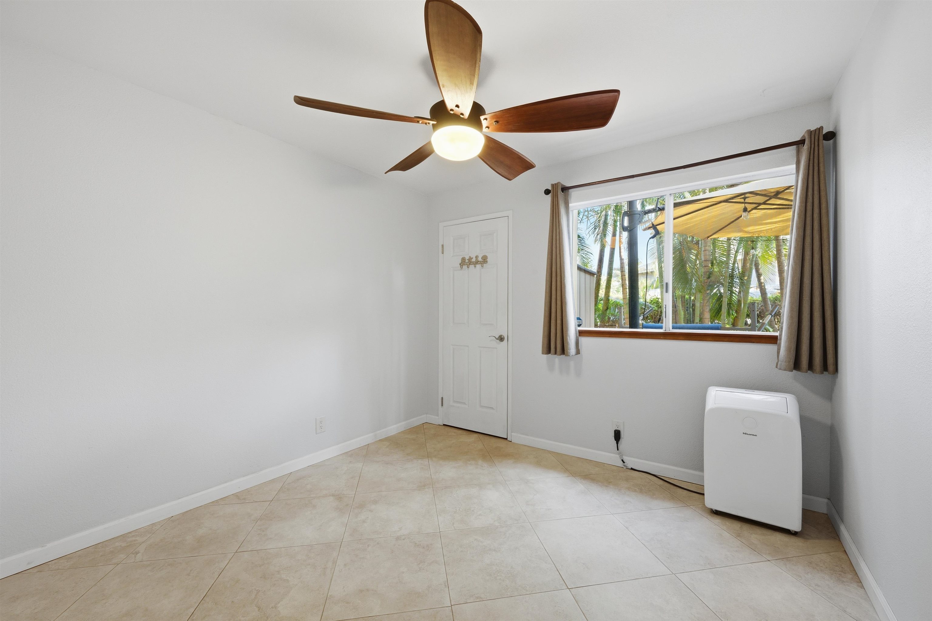 140 Uwapo Road, Unit 39101 Kihei, HI 96753 - Photo 22 of 35 a view of room with a ceiling fan and window