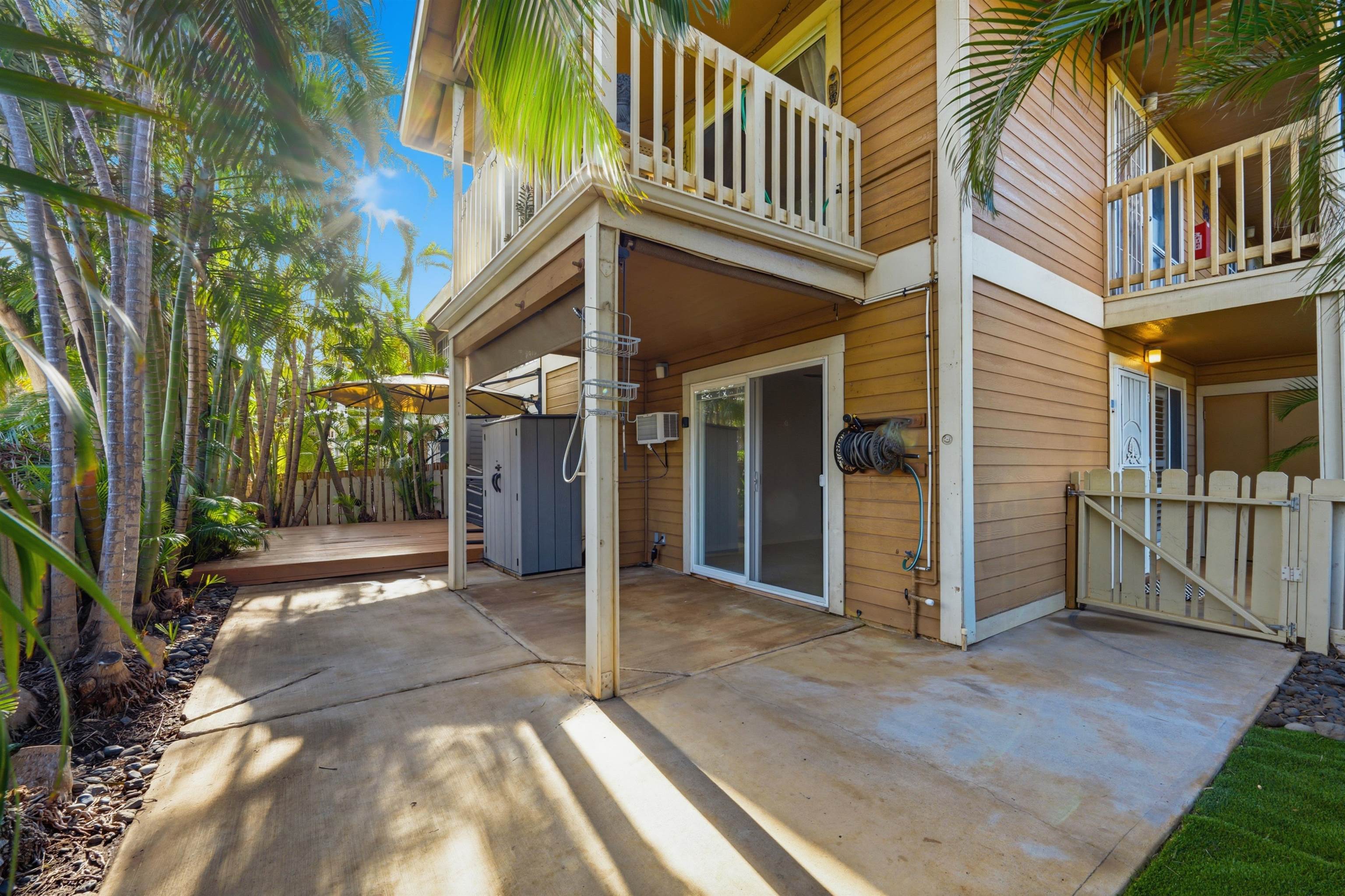 140 Uwapo Road, Unit 39101 Kihei, HI 96753 - Photo 26 of 35 a view of a house with a large windows and plants