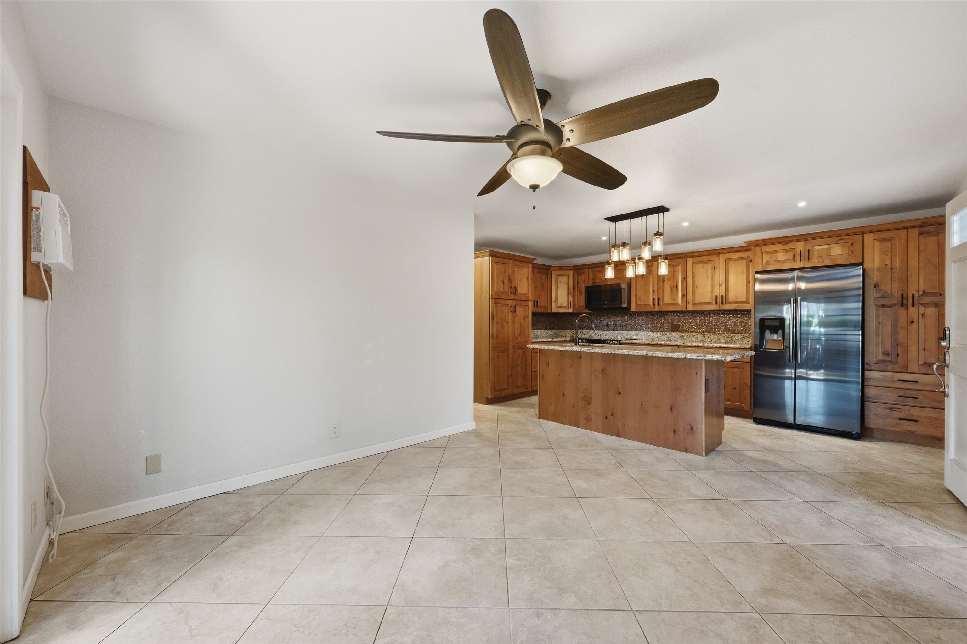 140 Uwapo Road, Unit 39101 Kihei, HI 96753 - Photo 6 of 35 a view of a kitchen with a sink and cabinets