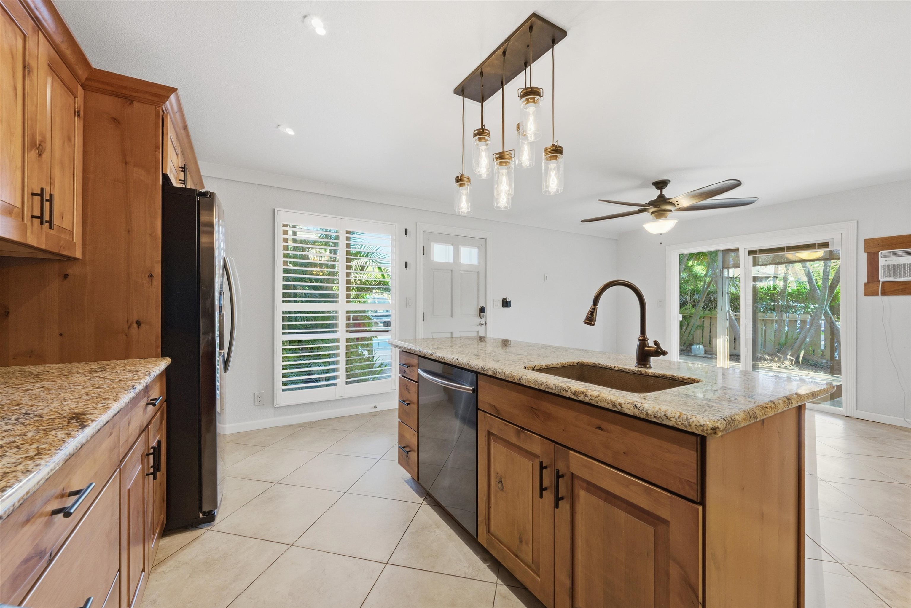 140 Uwapo Road, Unit 39101 Kihei, HI 96753 - Photo 9 of 35 a kitchen with a sink stove and cabinets