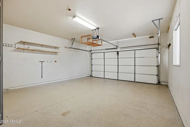 a kitchen with stainless steel appliances kitchen island granite countertop a stove a sink and a refrigerator