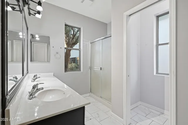 a bathroom with a sink and a window