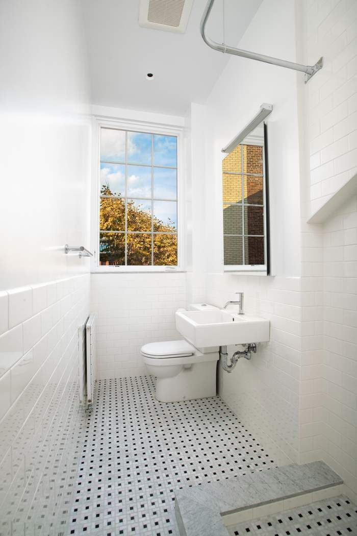 46 Commerce Street, Unit 5 Manhattan, NY 10014 - Photo 9 of 11 a bathroom with a sink toilet a mirror and next to a window