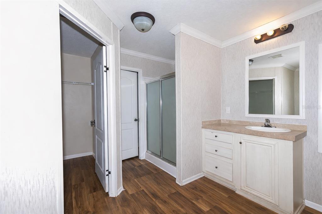 18057 Southwest 37th Street Dunnellon, FL 34432 - Photo 6 of 9 a spacious bathroom with a double vanity sink and mirror