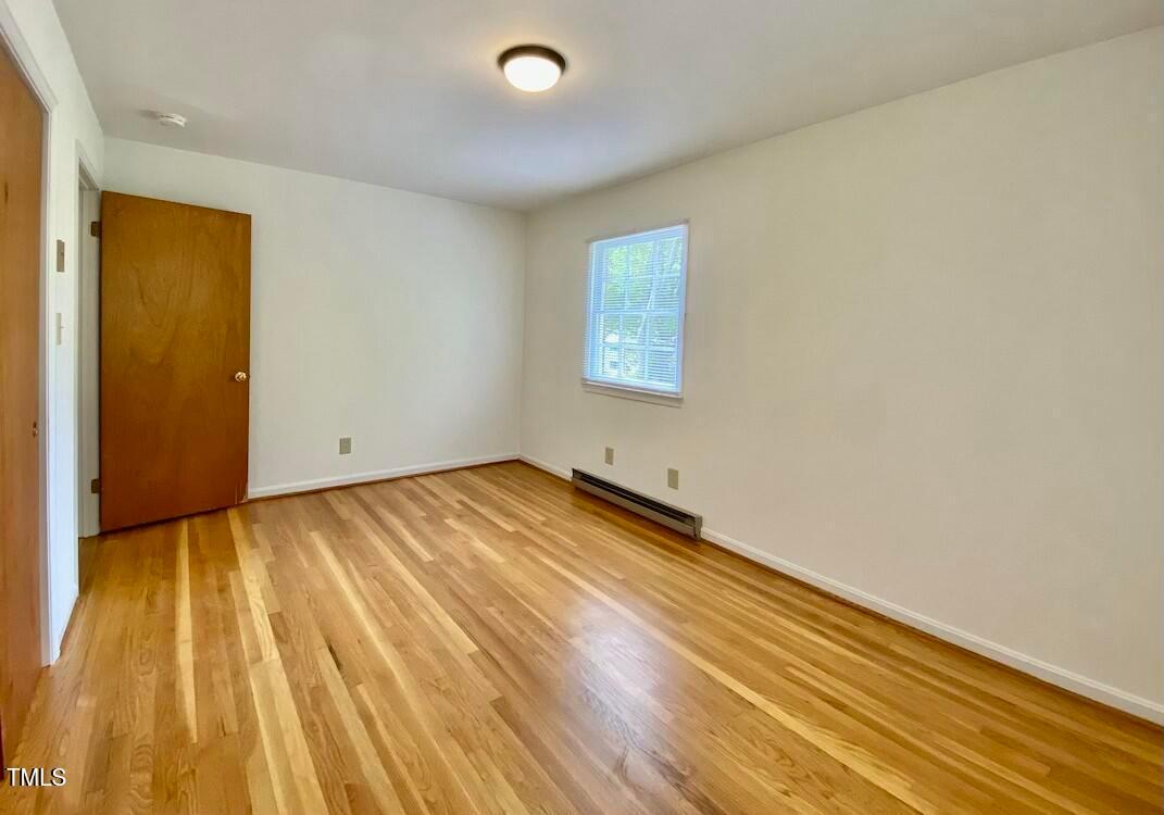 808 North Buchanan Boulevard, Unit B Durham, NC 27701 - Photo 23 of 23 a view of empty room with wooden floor