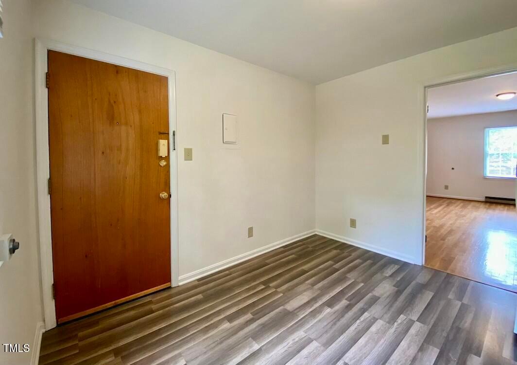 808 North Buchanan Boulevard, Unit B Durham, NC 27701 - Photo 10 of 23 a view of empty room with wooden floor