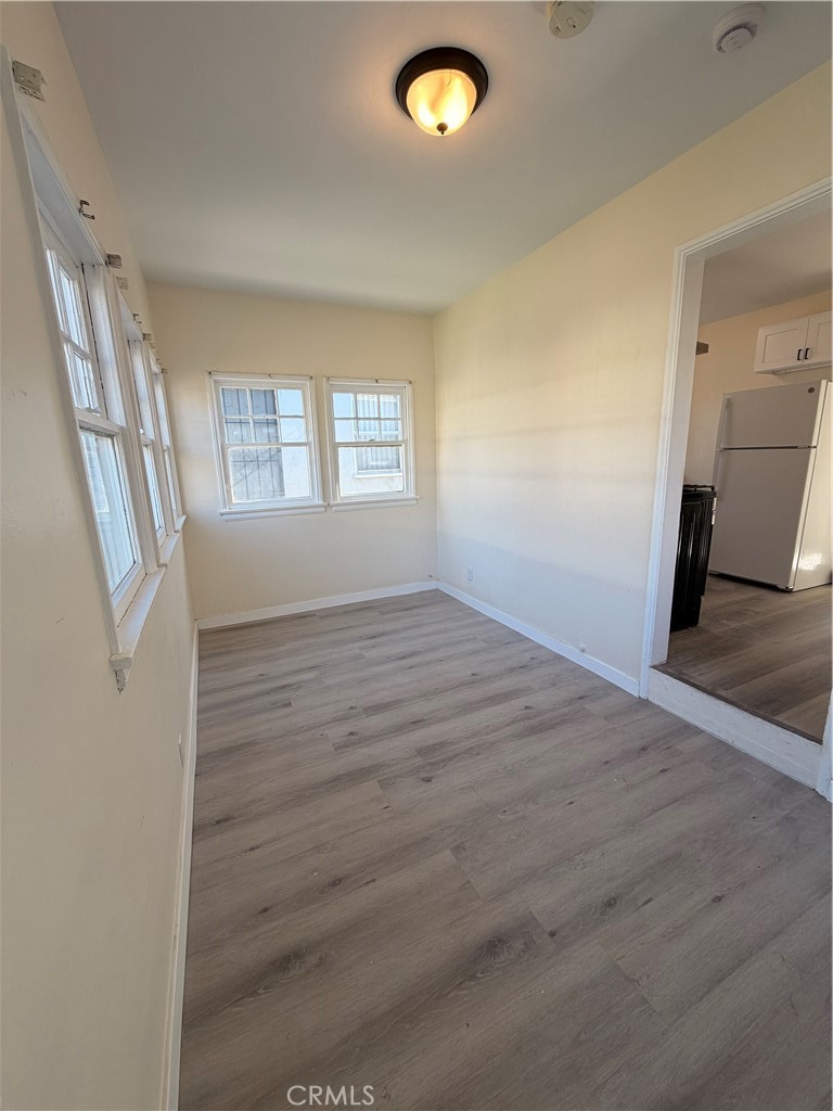 4510 Linsley Street Compton, CA 90221 - Photo 2 of 5 wooden floor in an empty room with a window