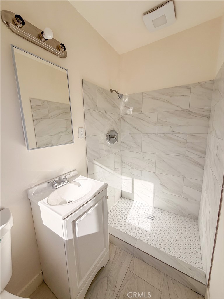 4510 Linsley Street Compton, CA 90221 - Photo 5 of 5 a bathroom with a sink a toilet and shower