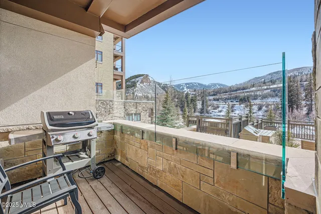 a view of a balcony with chairs