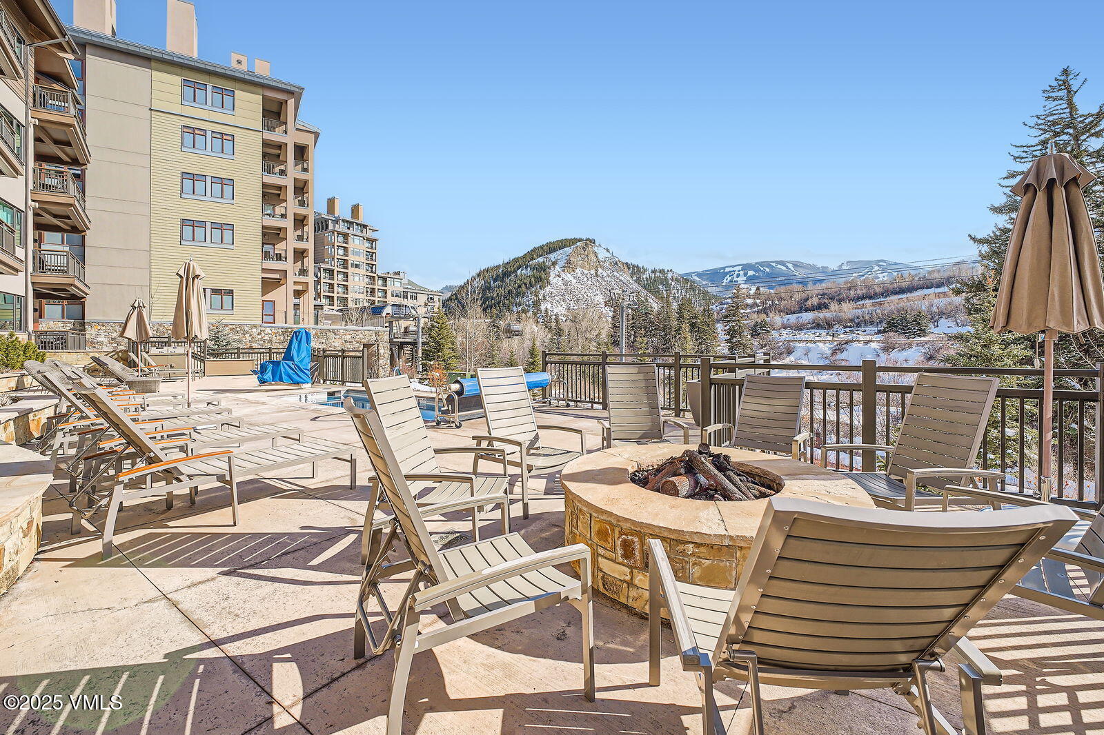1 Waterfront Way, Unit 102 Avon, CO 81620 - Photo 17 of 22 a view of a chairs and table on the terrace
