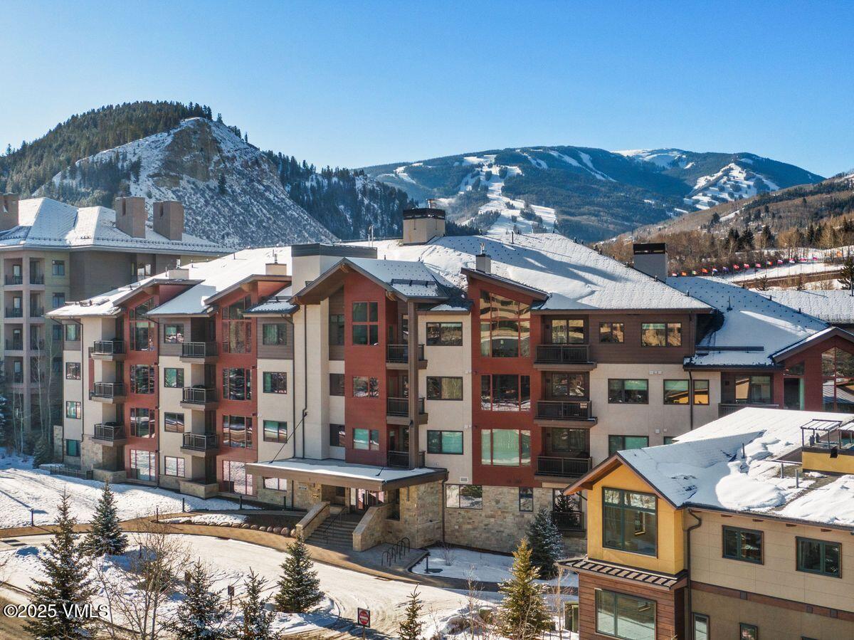 1 Waterfront Way, Unit 102 Avon, CO 81620 - Photo 18 of 22 a front view of a building with streets and trees
