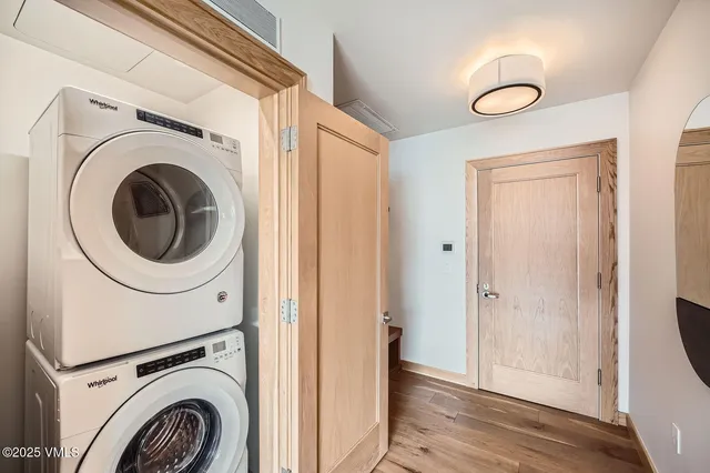 a view of a hallway with washer and dryer