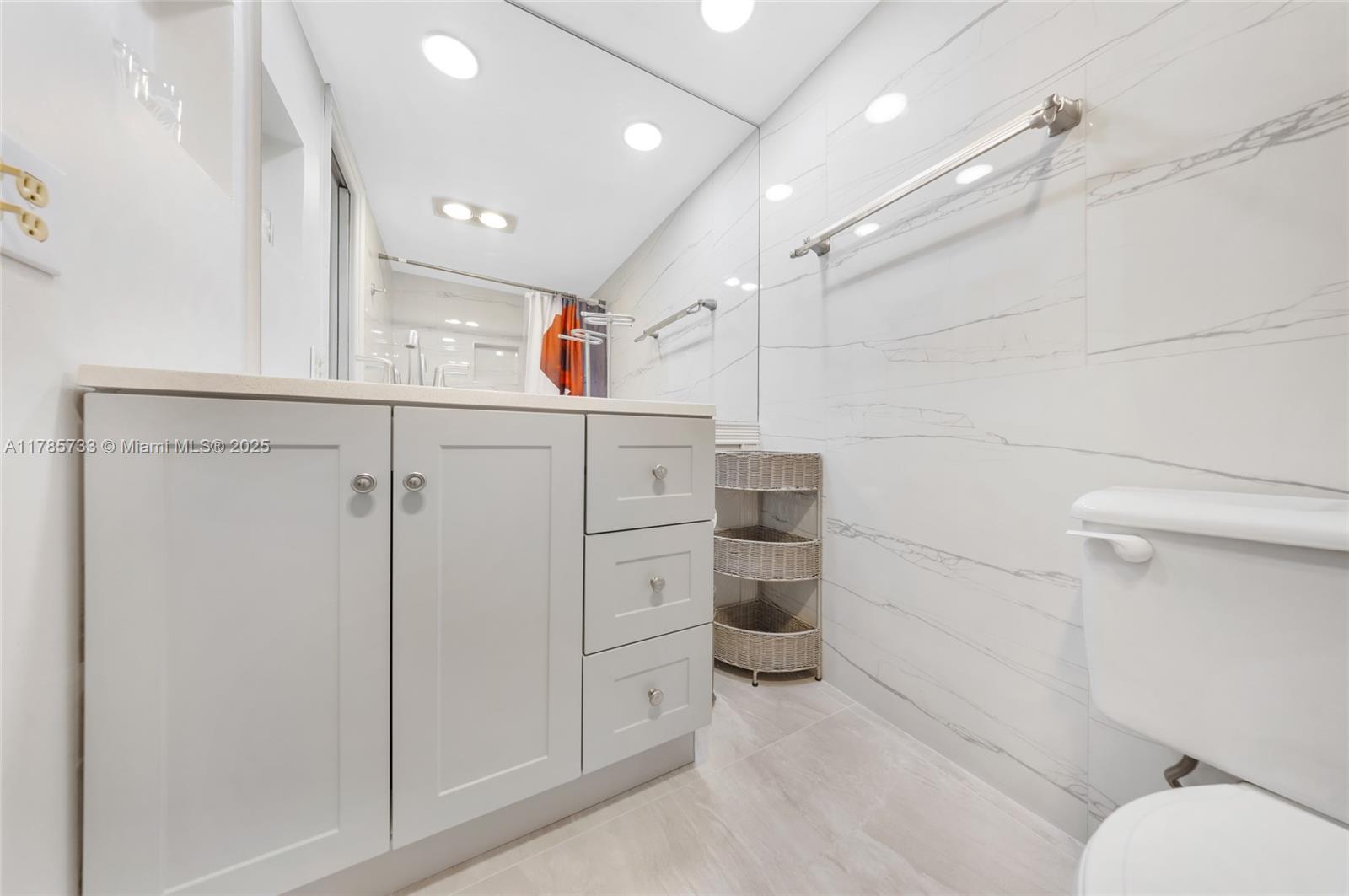 Palm Aire Pompano Beach, FL 33069 - Photo 16 of 27 a view of storage and utility room with washer and dryer