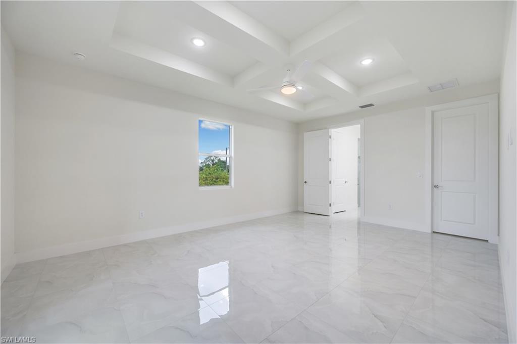 650 Kraft Street Lehigh Acres, FL 33974 - Photo 15 of 29 an empty room with windows