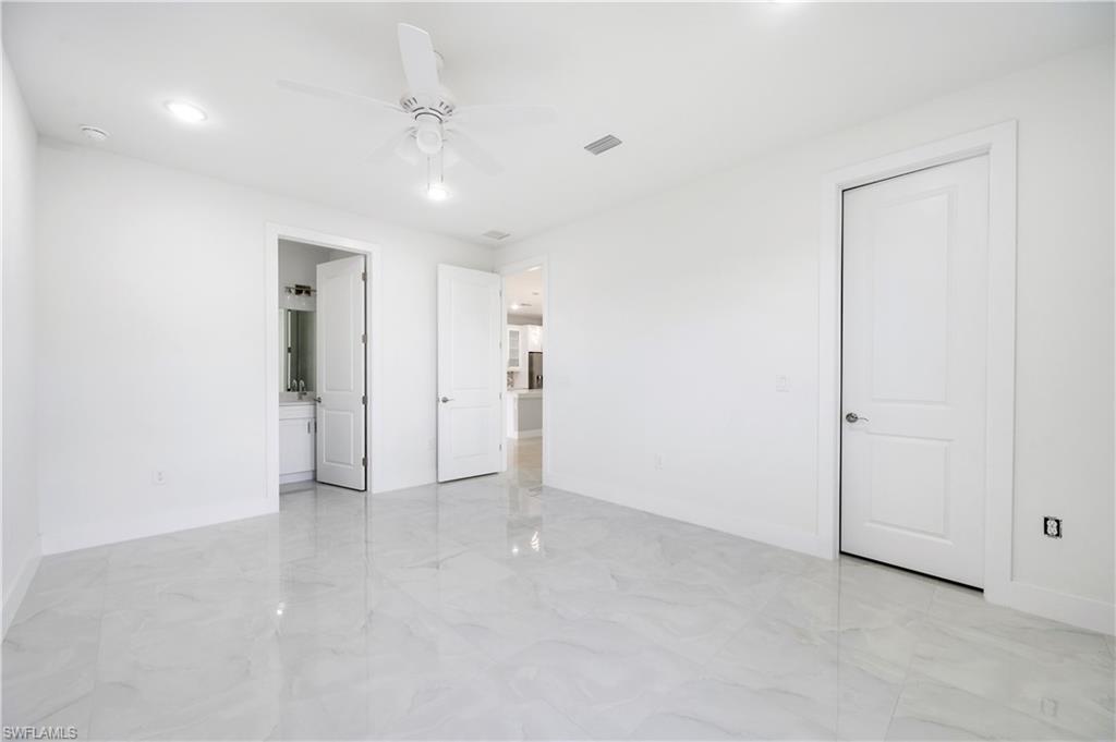 650 Kraft Street Lehigh Acres, FL 33974 - Photo 17 of 29 an empty room with an entryway