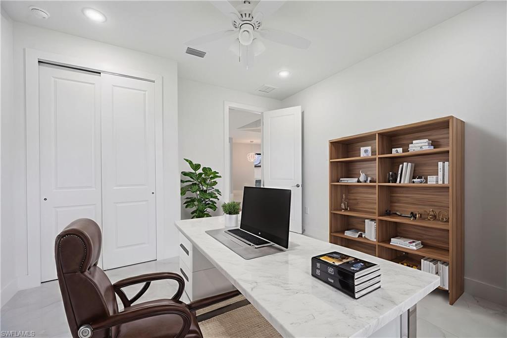 650 Kraft Street Lehigh Acres, FL 33974 - Photo 23 of 29 a workspace with furniture and window