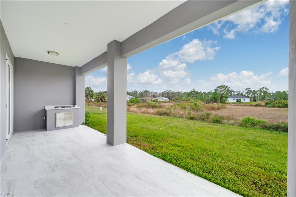 650 Kraft Street Lehigh Acres, FL 33974 - Photo 26 of 29 a view of a porch and garden